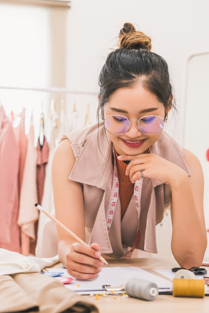 woman working with fabrics on a table - business and motherhood